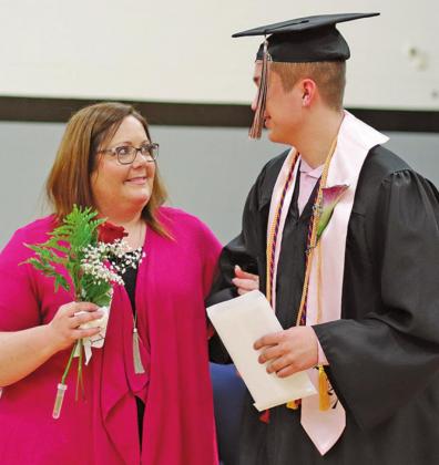 Gage Pollestad is escorted out of the gym by his Mom Lindsay following the Graduation Ceremony. VNV Photo by Lyle Van Camp