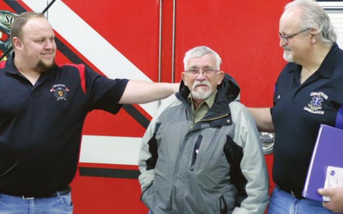 Jordan Grundstrom, left and Bill Tuttle, right, congratulate Bob Merrill Saturday afternoon. VNV photo by Lyle Van Camp