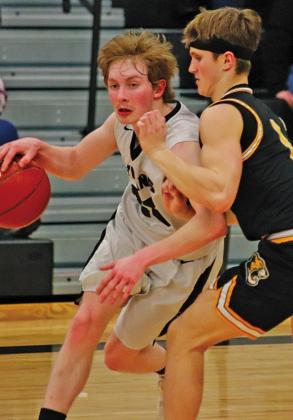 Lucas Anderson progresses the ball under intense defensive measures from Northern Cass last Tuesday night. VNV photo by Lesa Van Camp