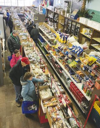 Shoppers peruse through a wide array of sweets. Photo by Larry Stoke.