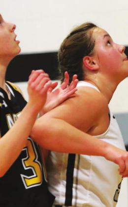Hailey Berg concentrates on a rebound in action against Park River. Photo provided by Drayton Public School Darla Hoyles