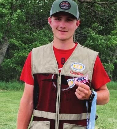 Cayden Quibell with his awards from the trapshooting season. Photo submitted
